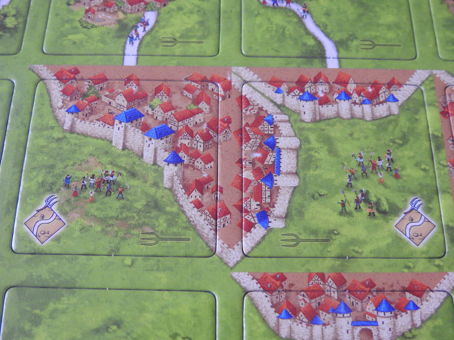 Close-up view of 2 of the tiles included.