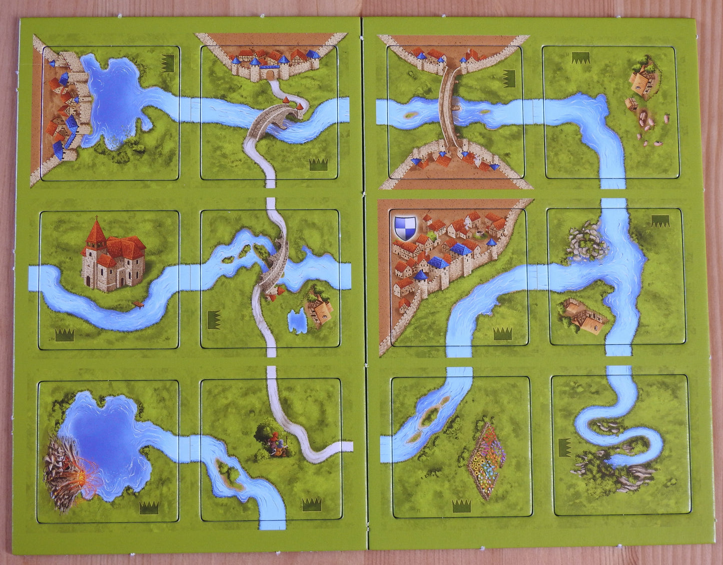 Top view of the 12 tiles that come with this River II Carcassonne Mini Expansion.
