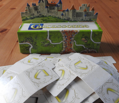 A view of the box and all the included tabs together in this 3D Starting Landscape mini expansion and accessory for the Carcassonne board game.