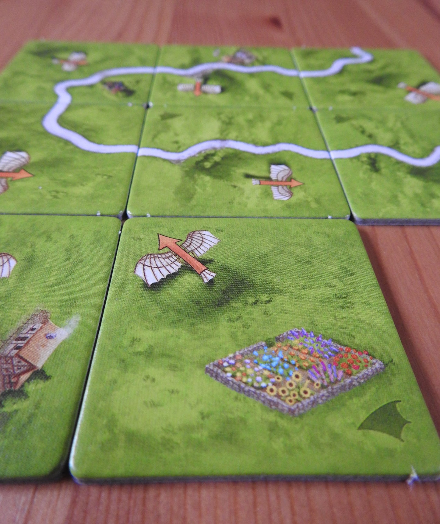 A closer view of the lovely artwork on the tiles in this Carcassonne Flying Machines mini expansion.