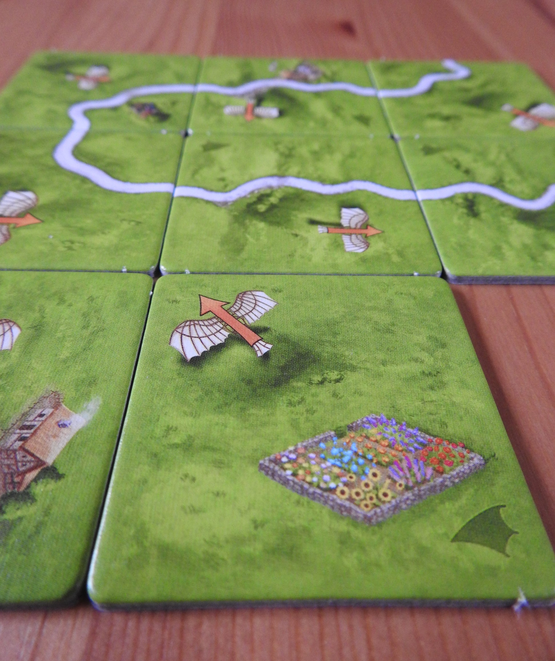 A closer view of the lovely artwork on the tiles in this Carcassonne Flying Machines mini expansion.