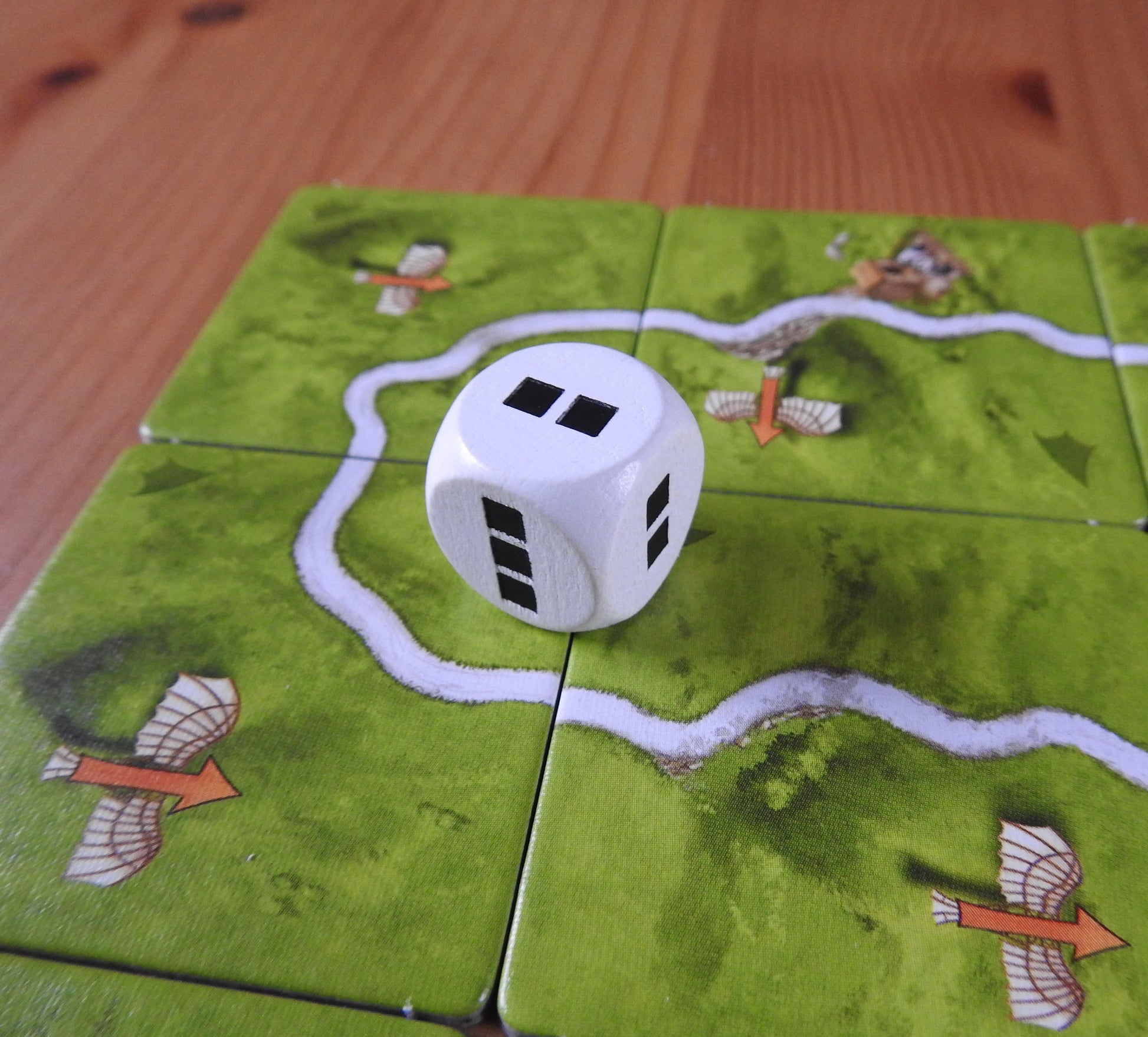 A close-up of the die that is included in this Carcassonne Flying Machines mini expansion.