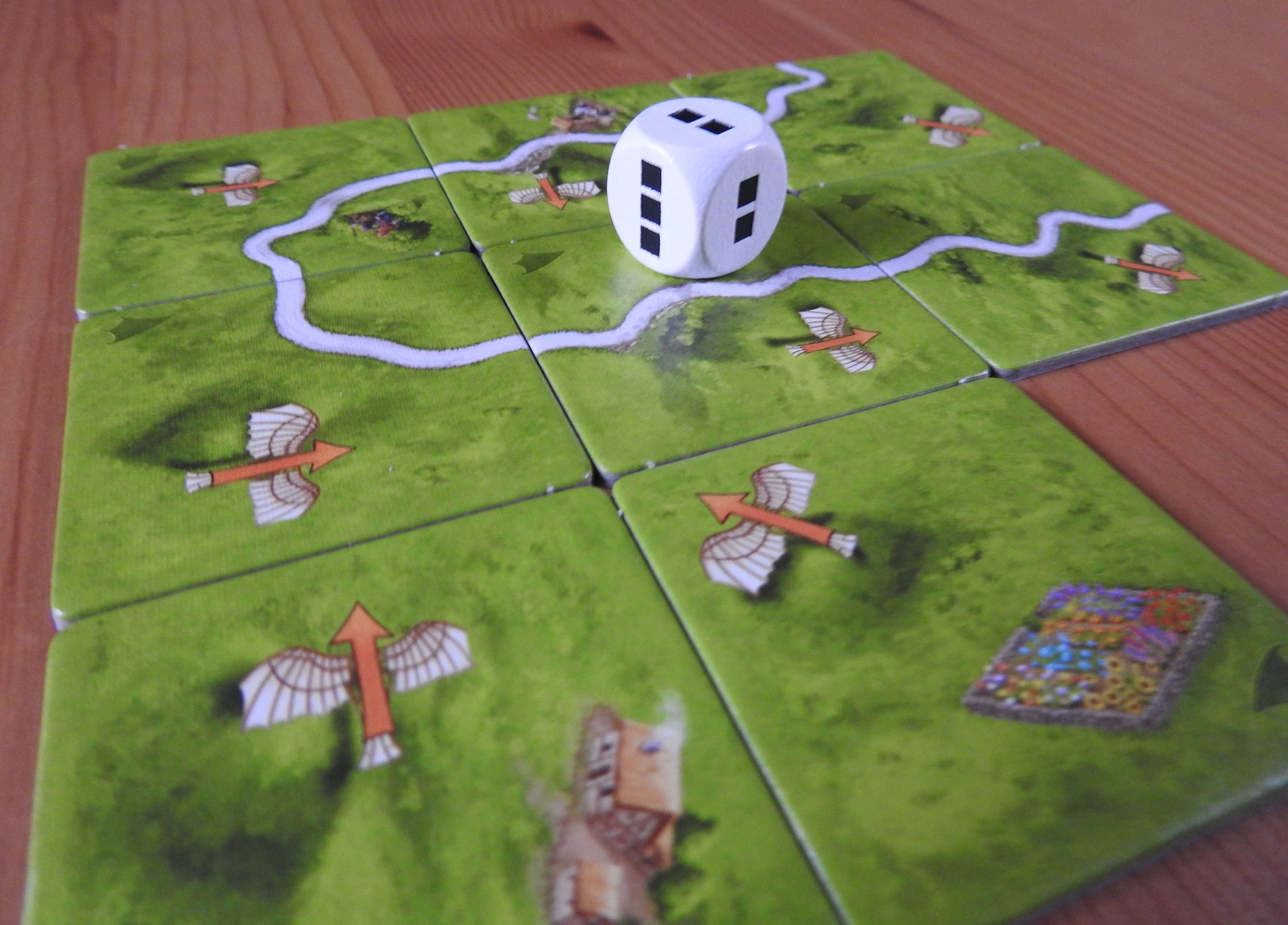 A view from a lower angle of all the pieces from this Carcassonne Flying Machines expansion.