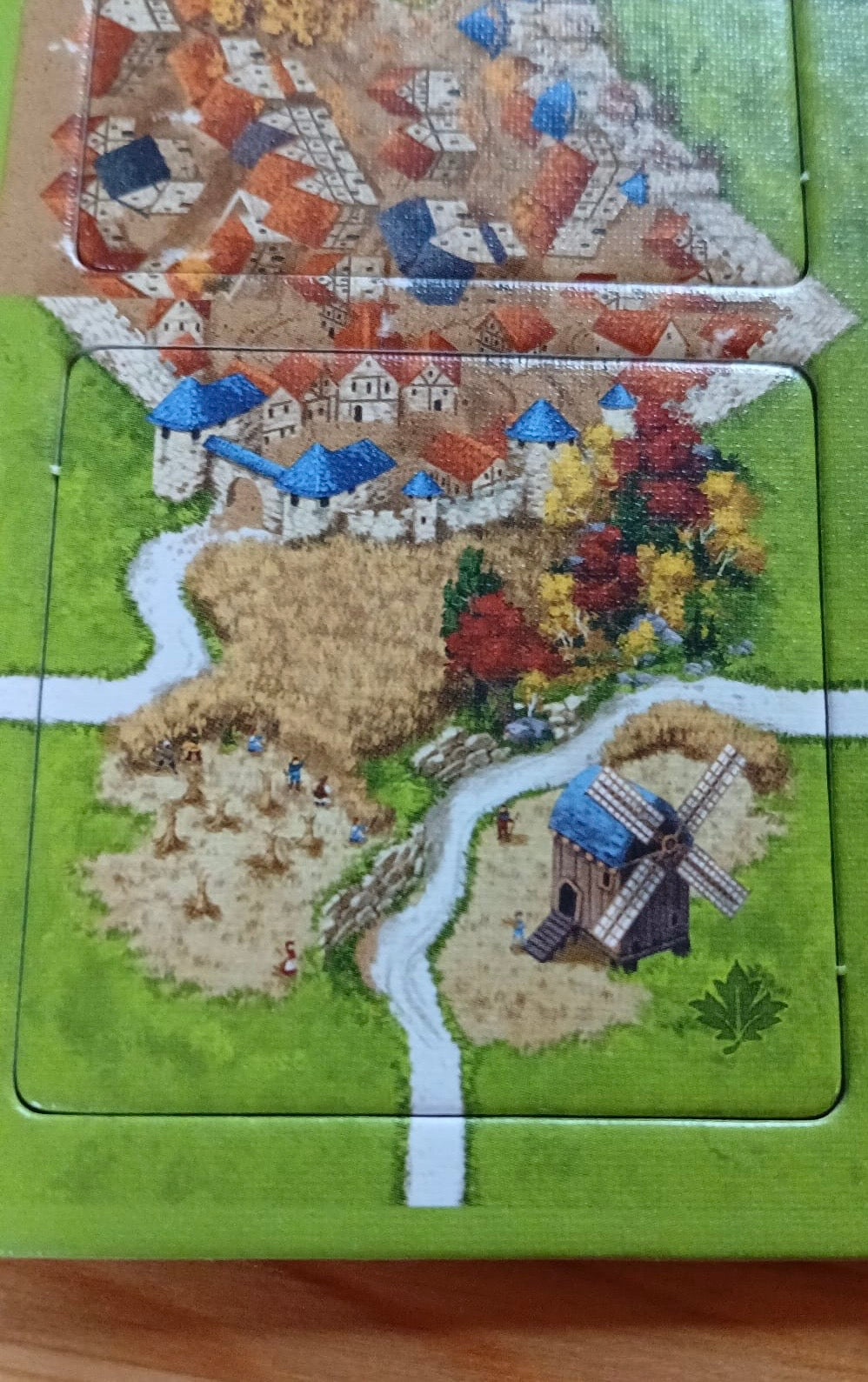 View of a beautiful windmill tile amongst the autumn crops in this Autumn mini expansion for the Carcassonne board game.