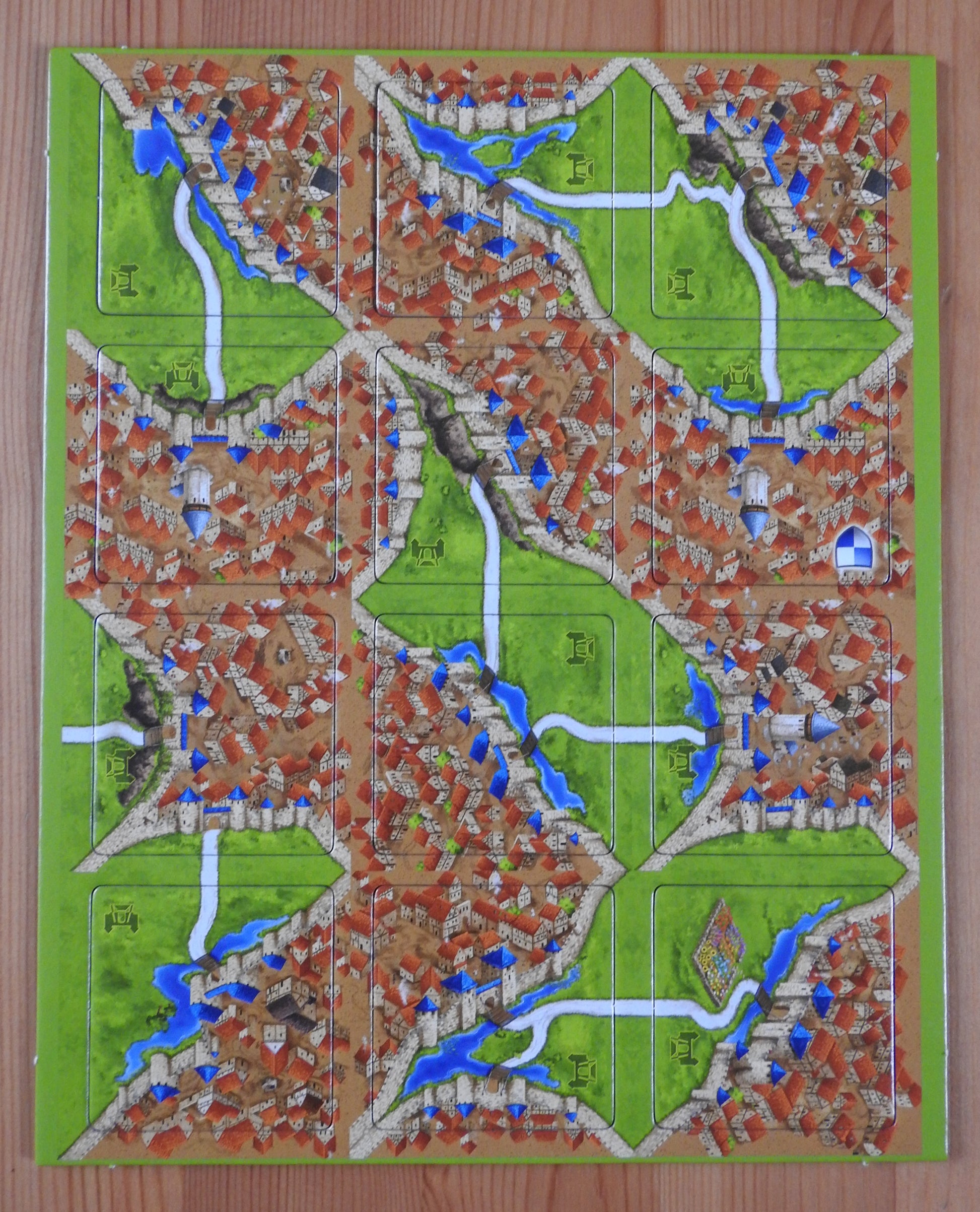 Top view of all 12 of the Drawbridges tiles included in this Carcassonne mini expansion.