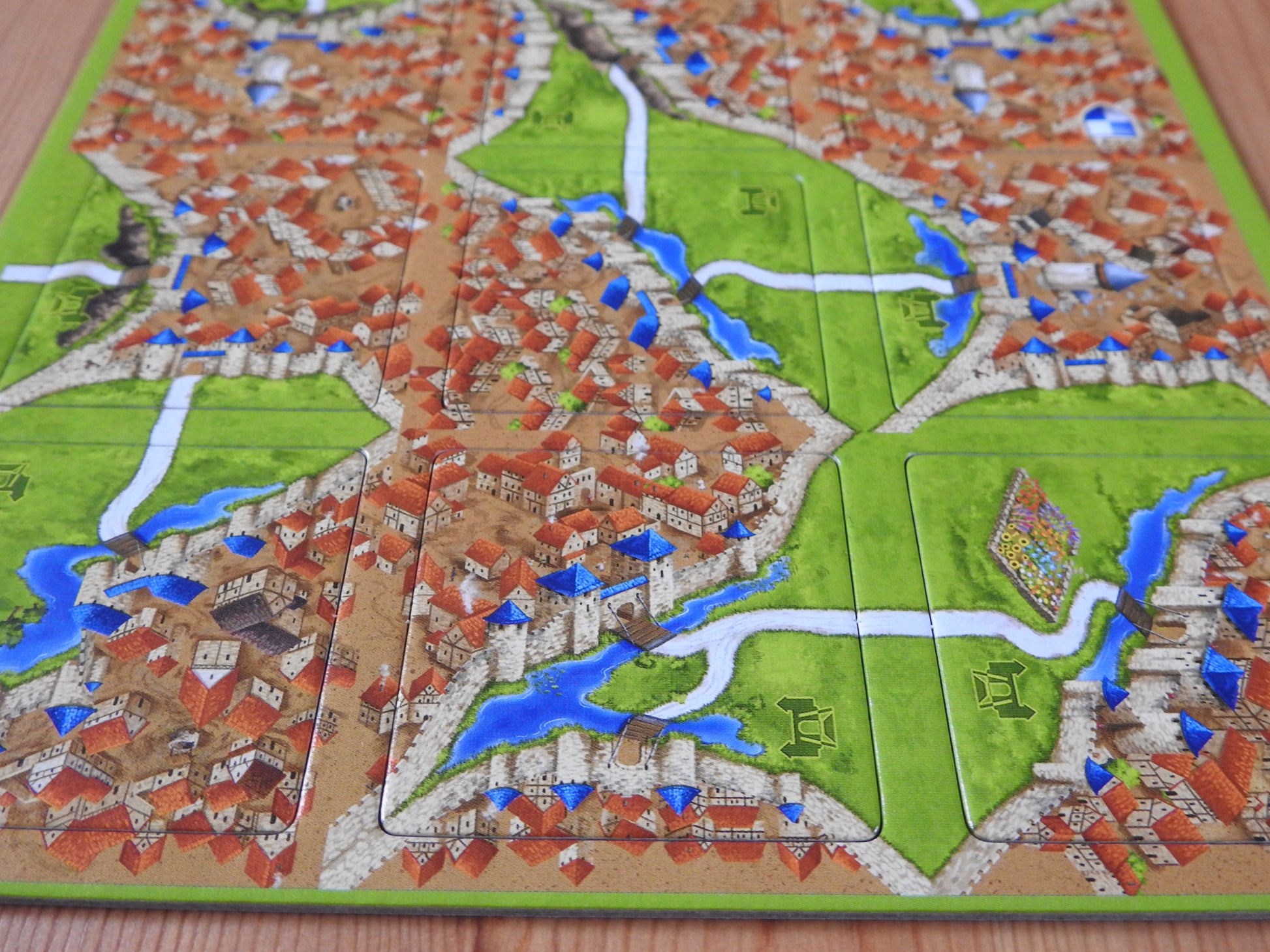 Close-up view of the bottom 6 tiles of this Carcassonne Drawbridges mini expansion.