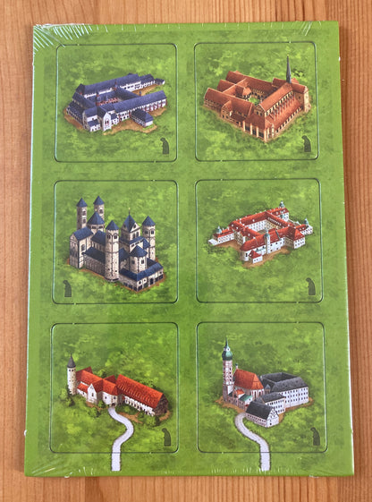 Front view of the 6 tiles included in this Carcassonne German Monasteries mini expansion.