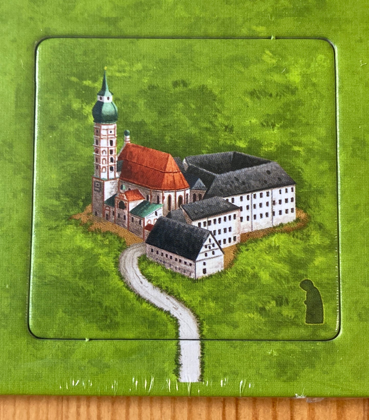 Beautiful German monastery set against the emerald background of the tile.