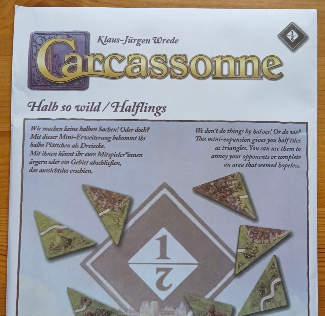 View of the envelope that the tiles come in for this Halflings 1 & 2 mini expansion for the Carcassonne board game.