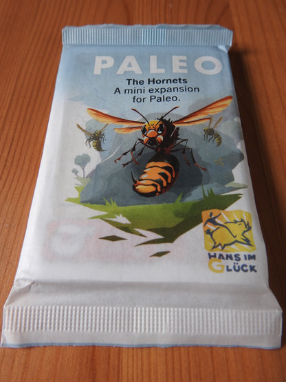 Another view of the front of the deck of cards, with an angry-looking hornet on the packaging for this Paleo Hornets mini expansion.