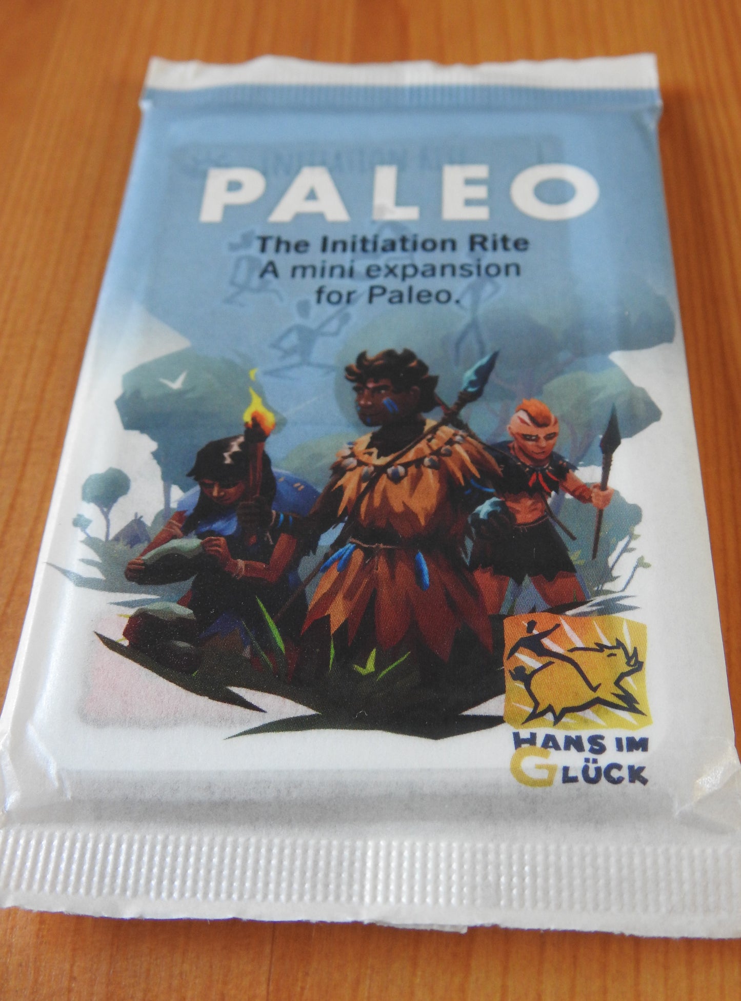 Another view of the front of the deck of cards, with illustrations of some characters featured in this Paleo Initiation Rite mini expansion.