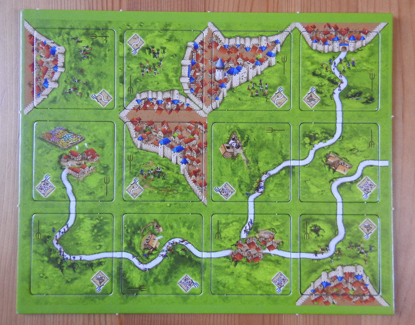View of all 12 of the landscape tiles included in this Peasant Revolts mini expansion for Carcassonne.