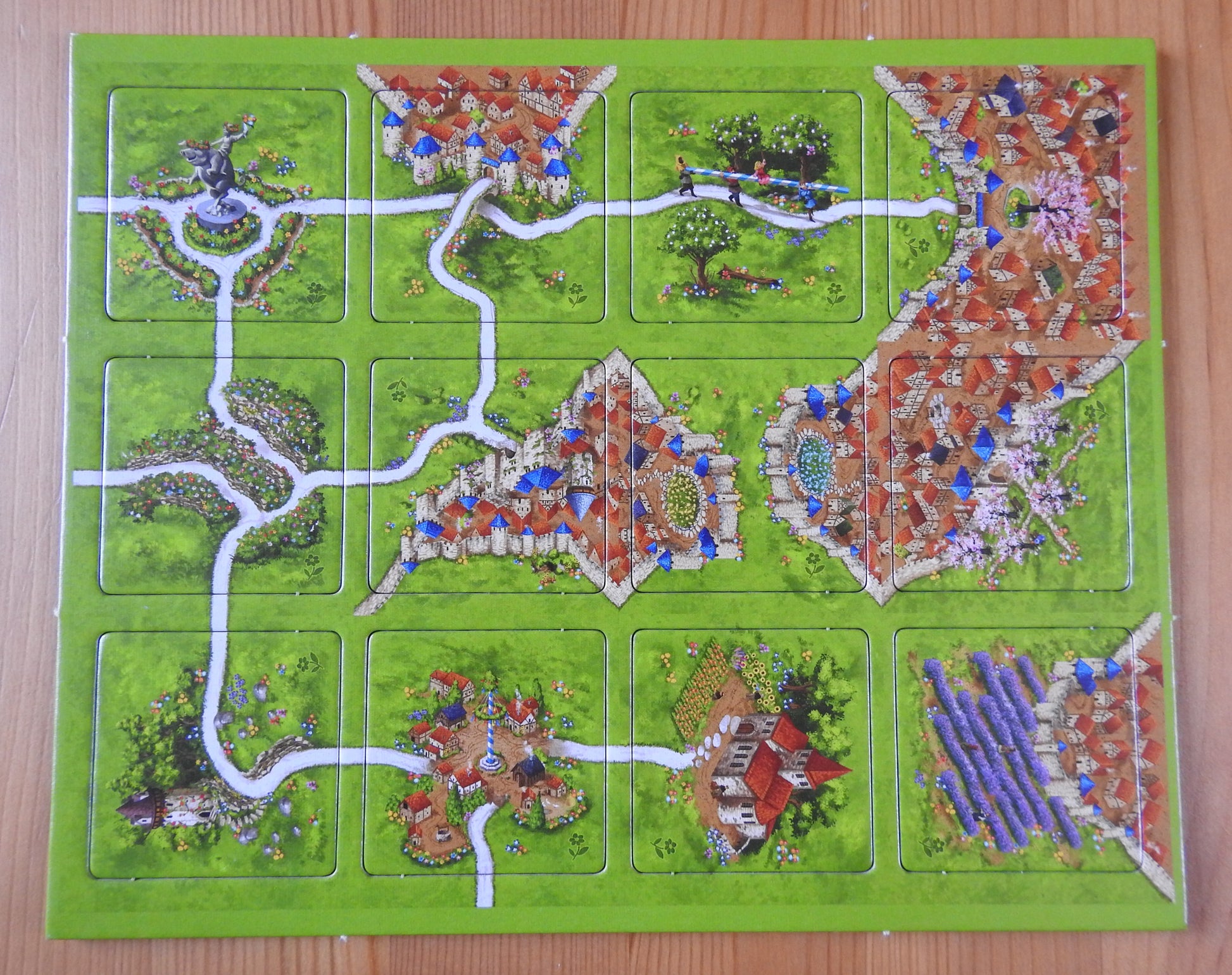 View of all 12 landscape tiles included in this Spring mini expansion for Carcassonne.