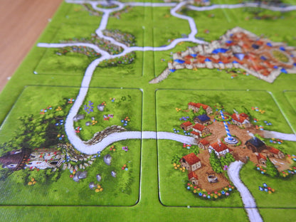 View of some more tiles, including a maypole in the middle of the village in this Spring mini expansion for Carcassonne.