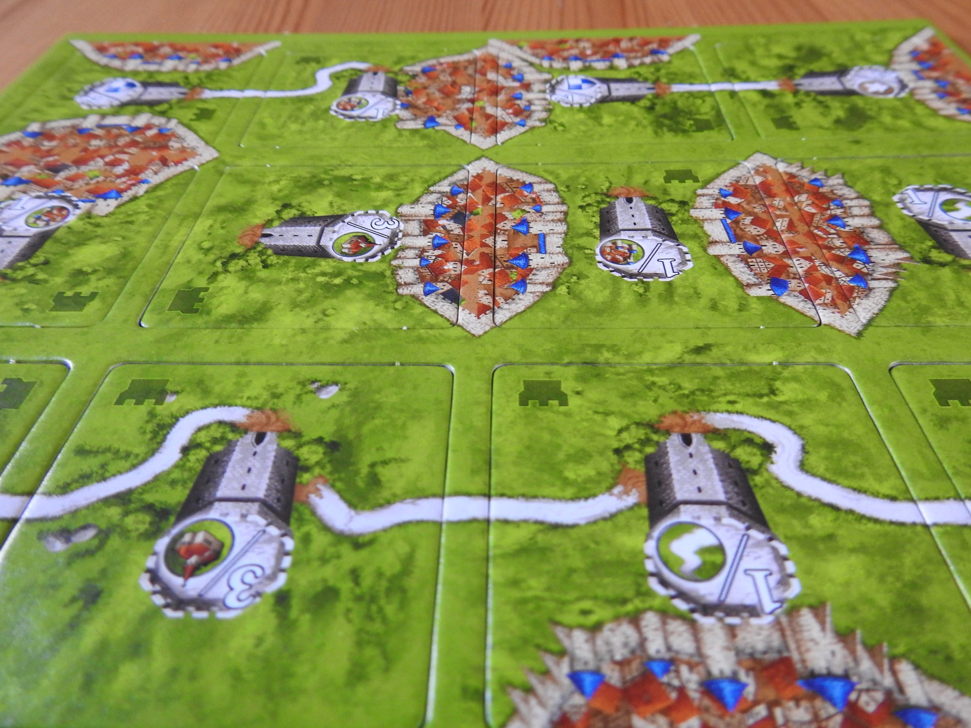 Close-up view of the watchtowers featured on the tiles of this Watchtowers mini expansion for the Carcassonne board game.