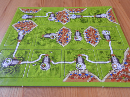 View of all 12 of the included tiles in this Watchtowers mini expansion for the Carcassonne board game.