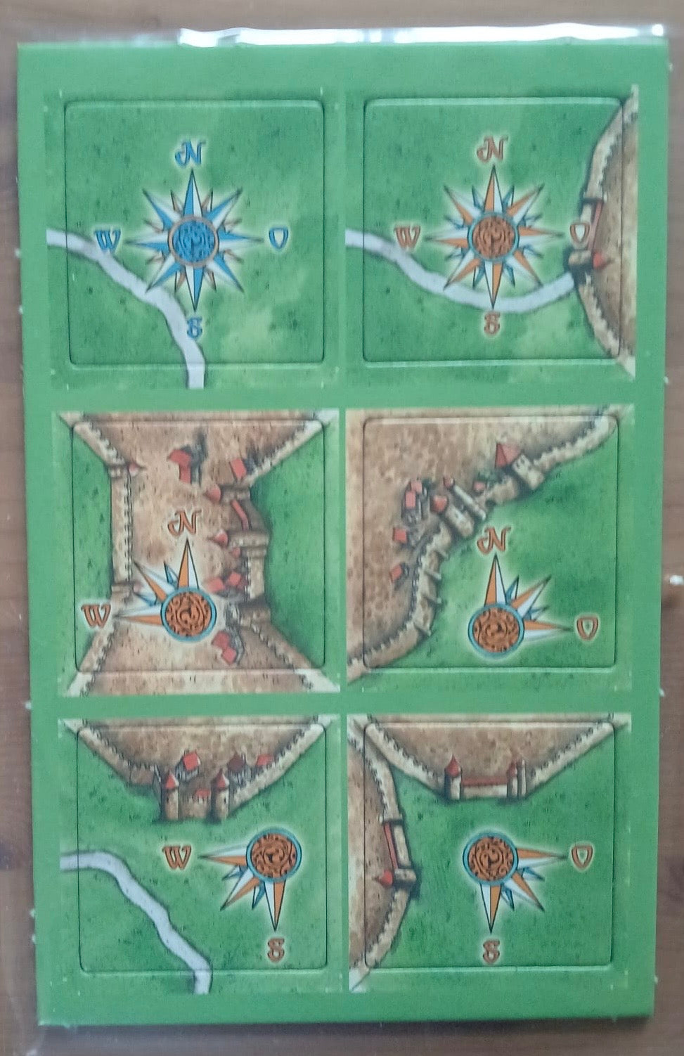 View of all 6 included tiles in this Windroses mini expansion for the Carcassonne board game.