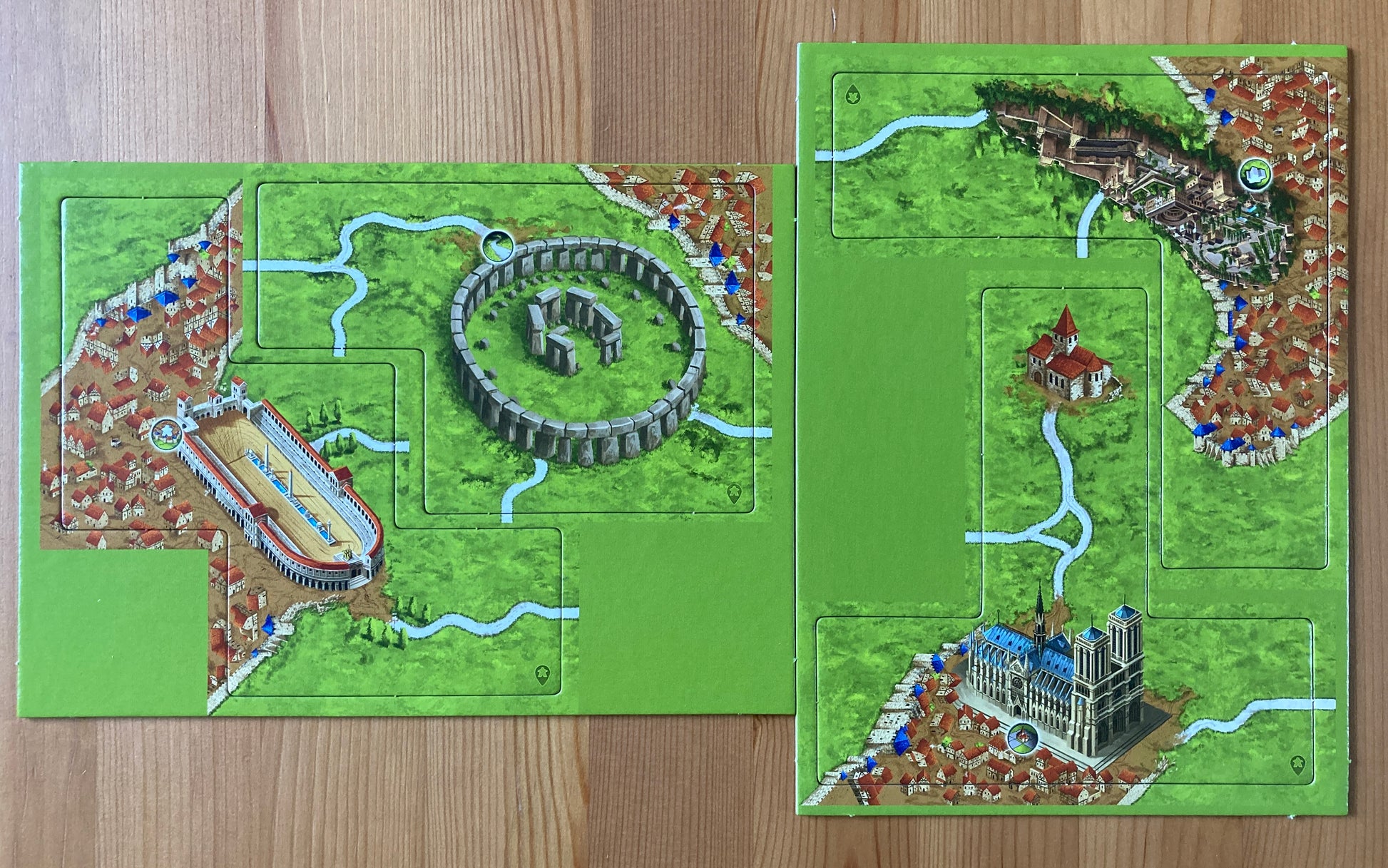 View of both included tile sheets from this Wonders of Humanity mini expansion for Carcassonne.