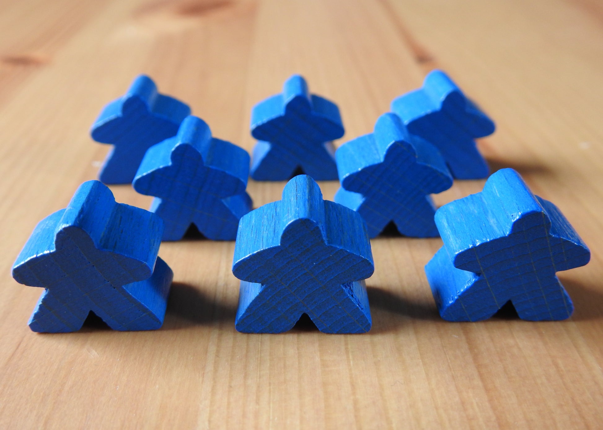 Close-up view of the blue set of 8 meeples.