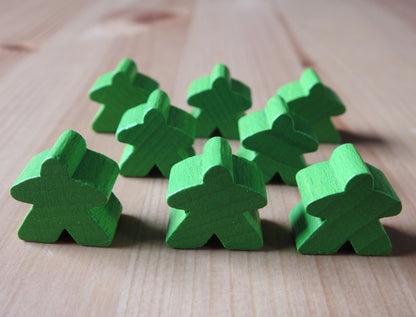Close-up view of the light green set of 8 meeples.