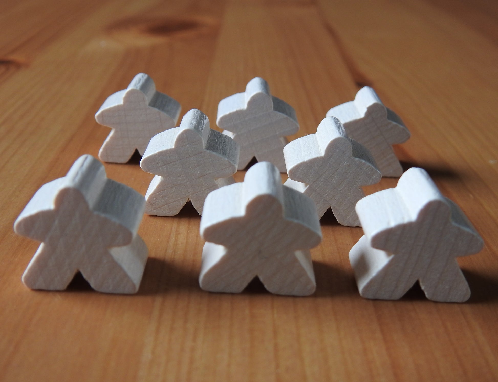 Close-up view of the white set of 8 meeples.