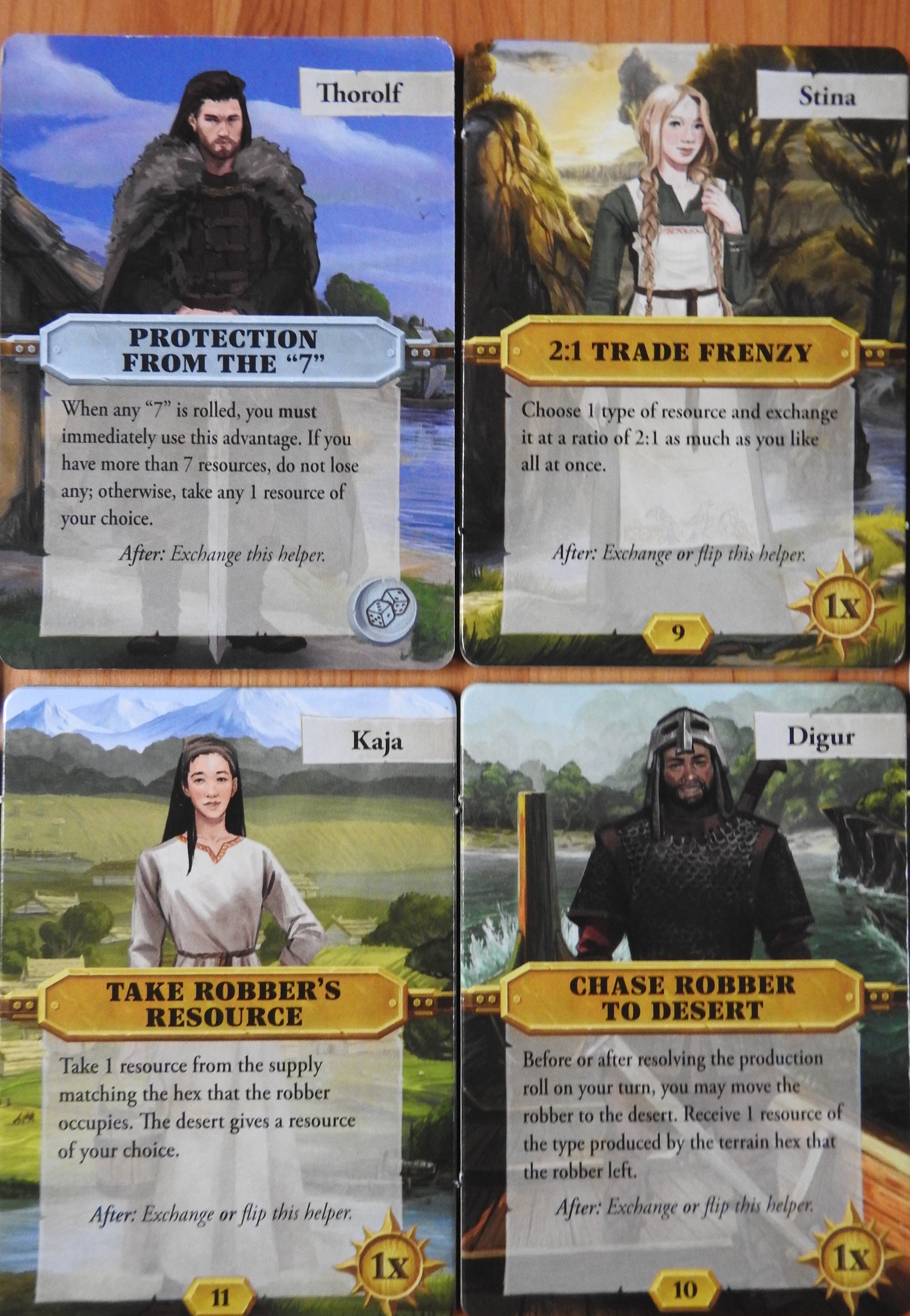 Close-up view of 4 more of the character tiles that come with this Catan Scenarios Helpers mini expansion.