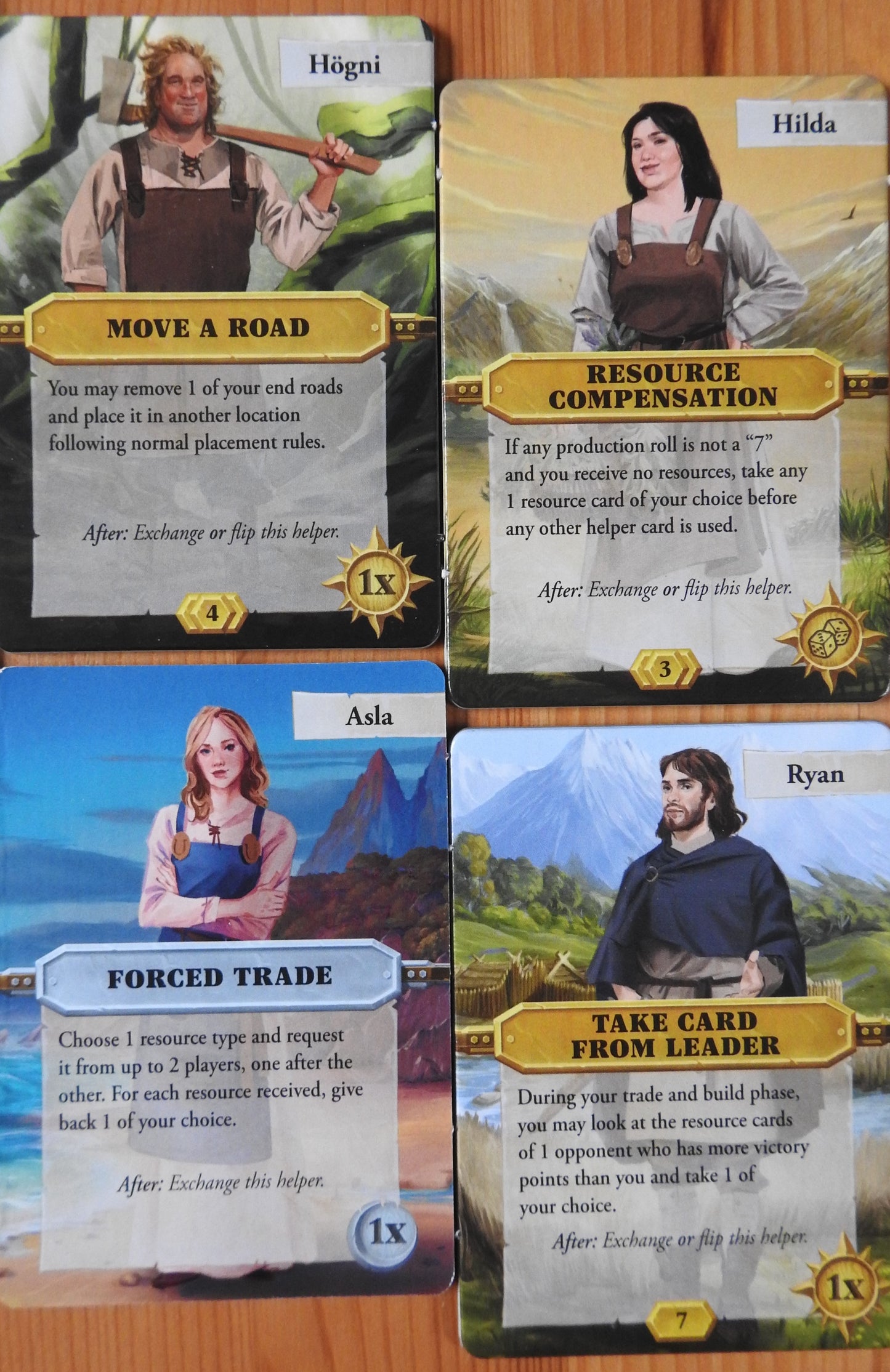Close-up view of the final 4 character tiles that come with this Catan Scenarios Helpers mini expansion.