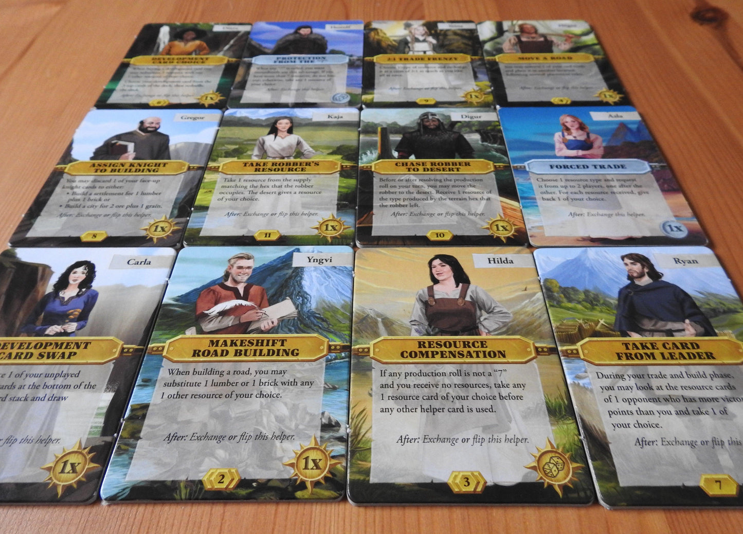 A lower angle view of all 12 of the character tiles included in this Catan Scenarios Helpers mini expansion.