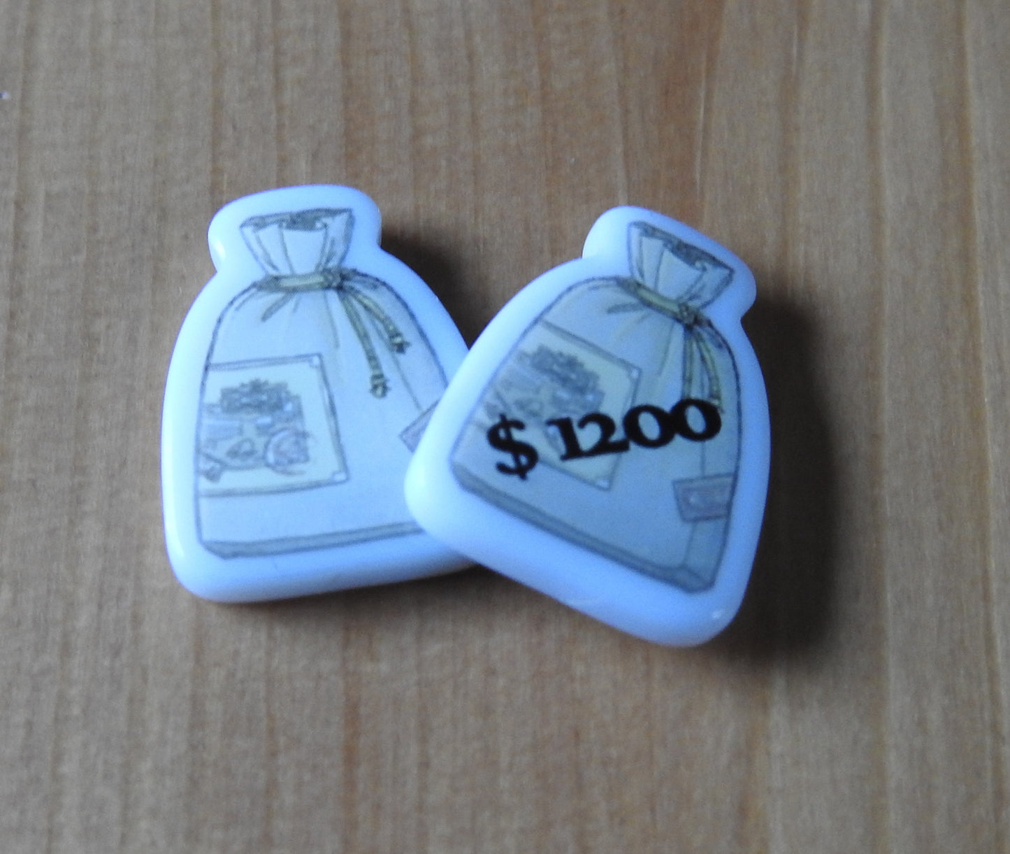Close-up view of the 2 money bags that are included.