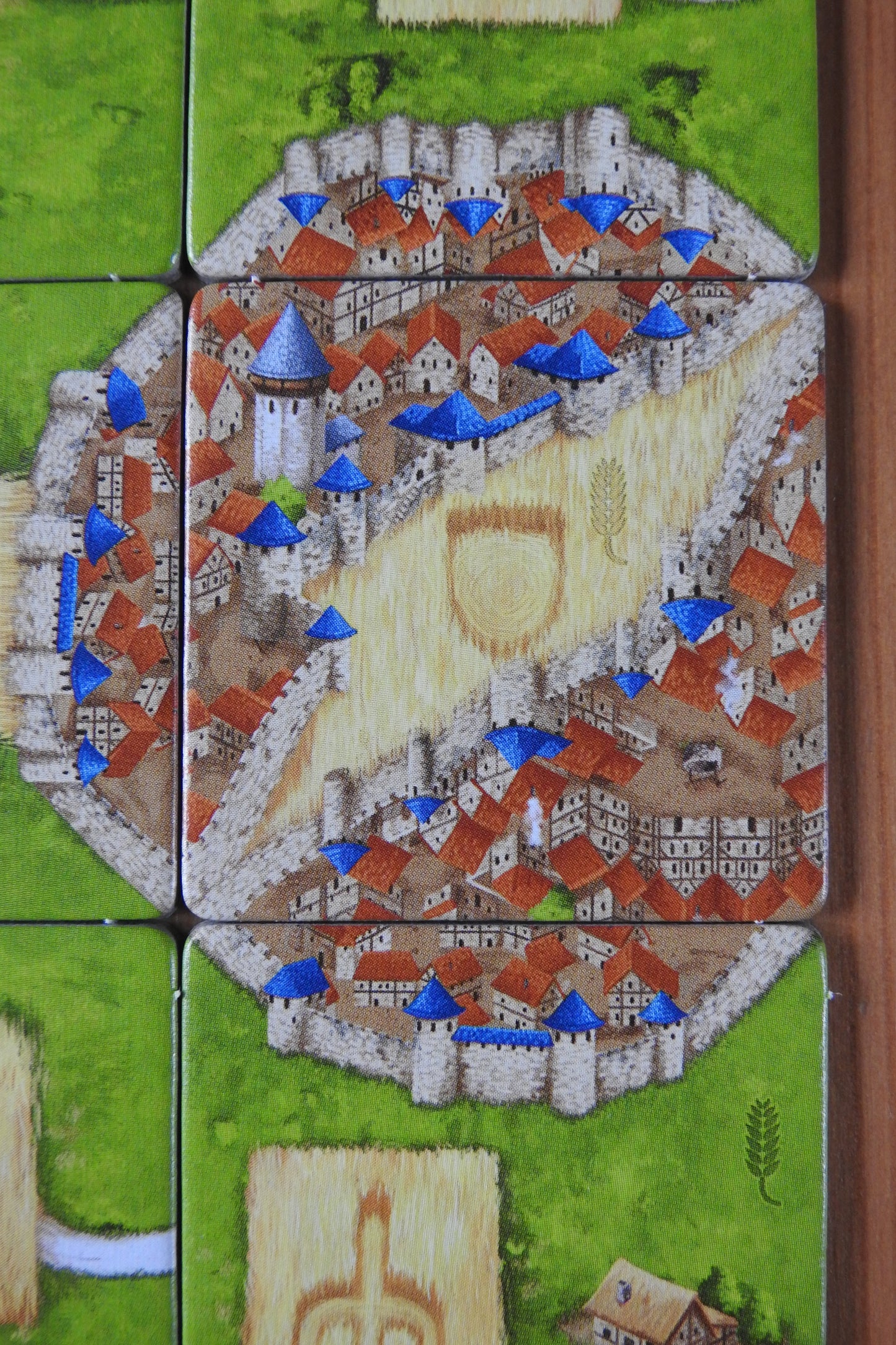 Close-up of one of the included tiles, featuring cornfields and two cities in this Carcassonne Corn Circles II expansion.