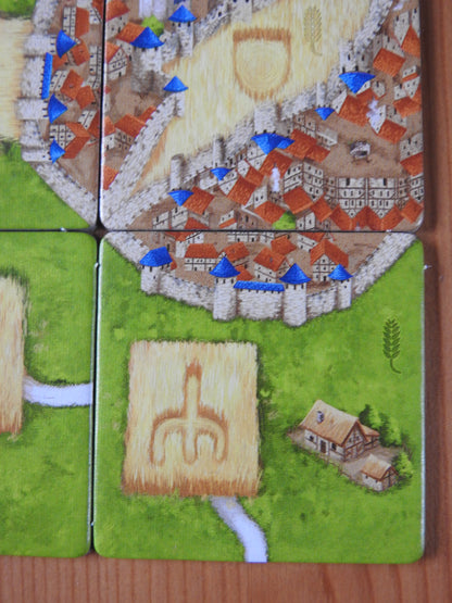 Close-up of another tile, showing roads and a cornfield in this Carcassonne Corn Circles II expansion.