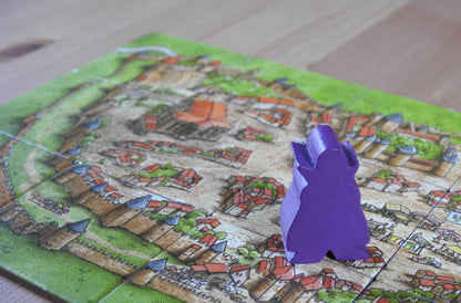 Close-up of the Count meeple figure brooding in the city of Carcassonne. Scary!