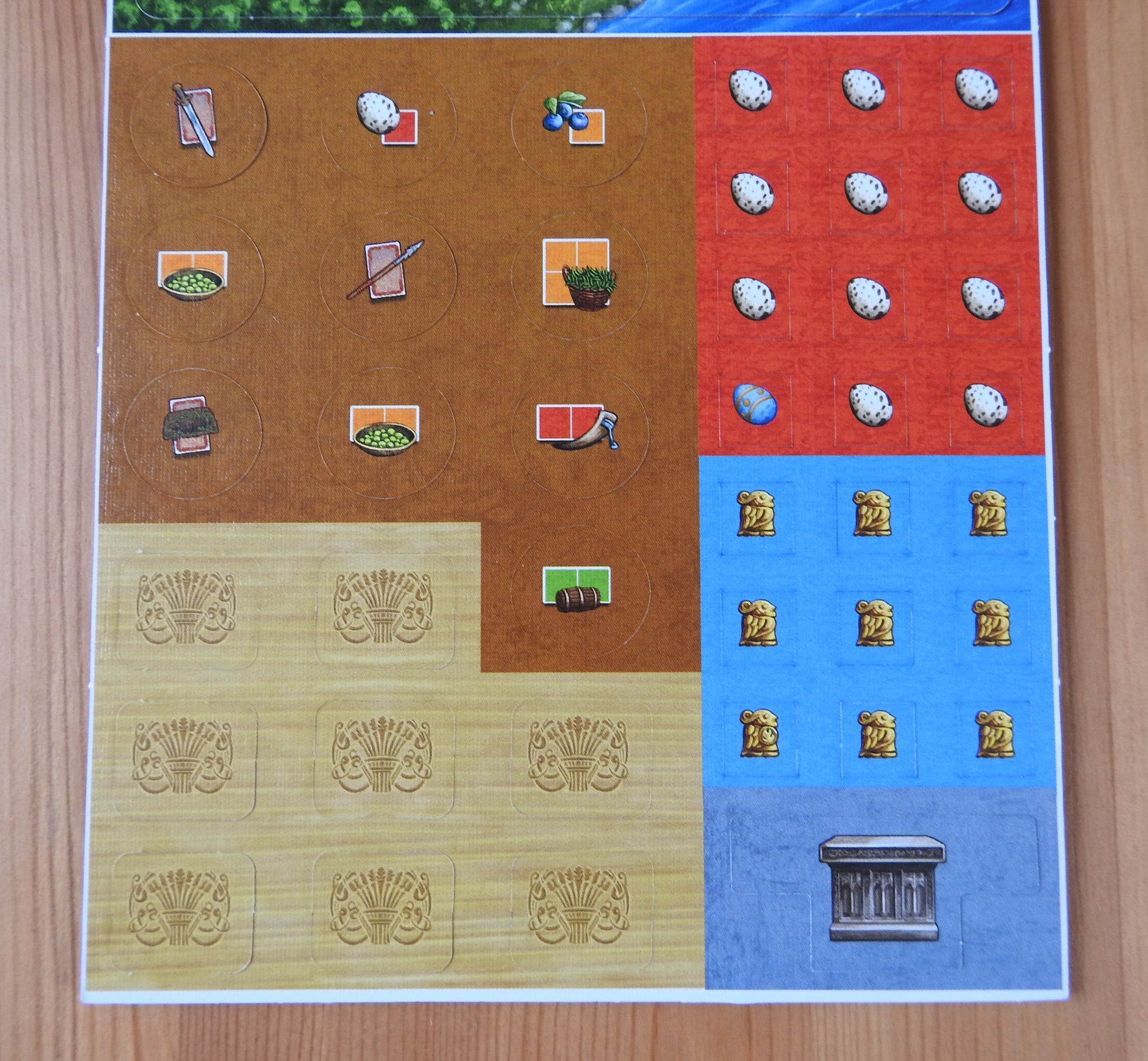 Closer view of the reverse side of the new tiles and counters that come with the Mull & Caithness mini expansion for Feast for Odin.
