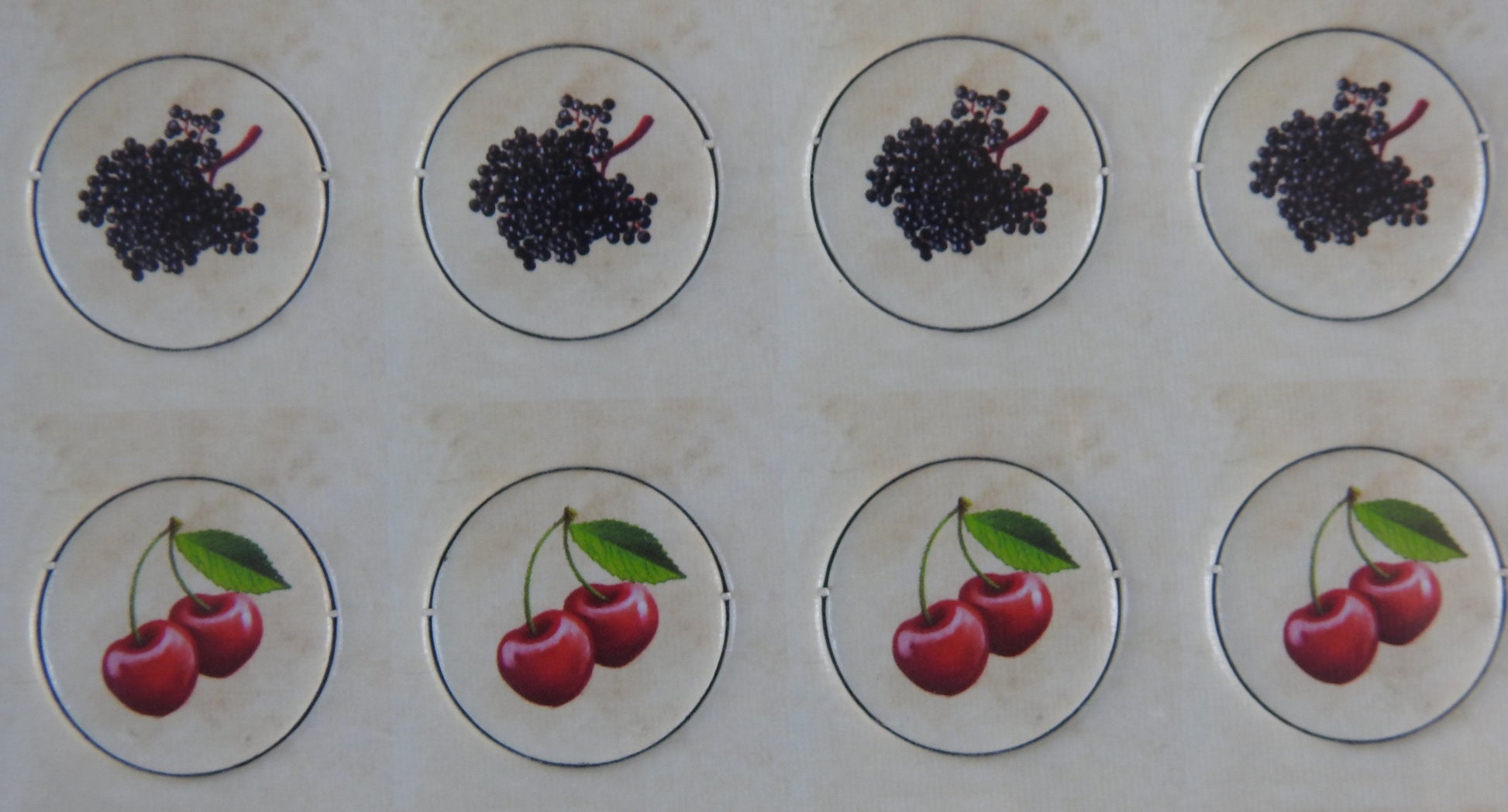 Close-up of 4 grape and 4 cherry counters included.