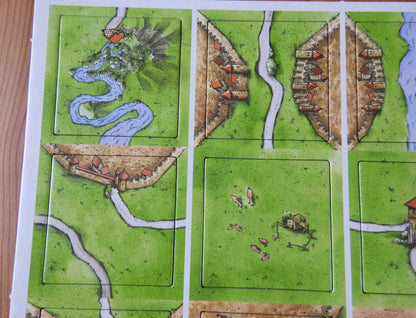 Close-up of 4 more of the tiles, featuring a spring and various cities and roads winding around the Carcassonne countryside.