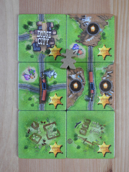 Another view of the six tiles included, along with the Sheriff meeple figure.