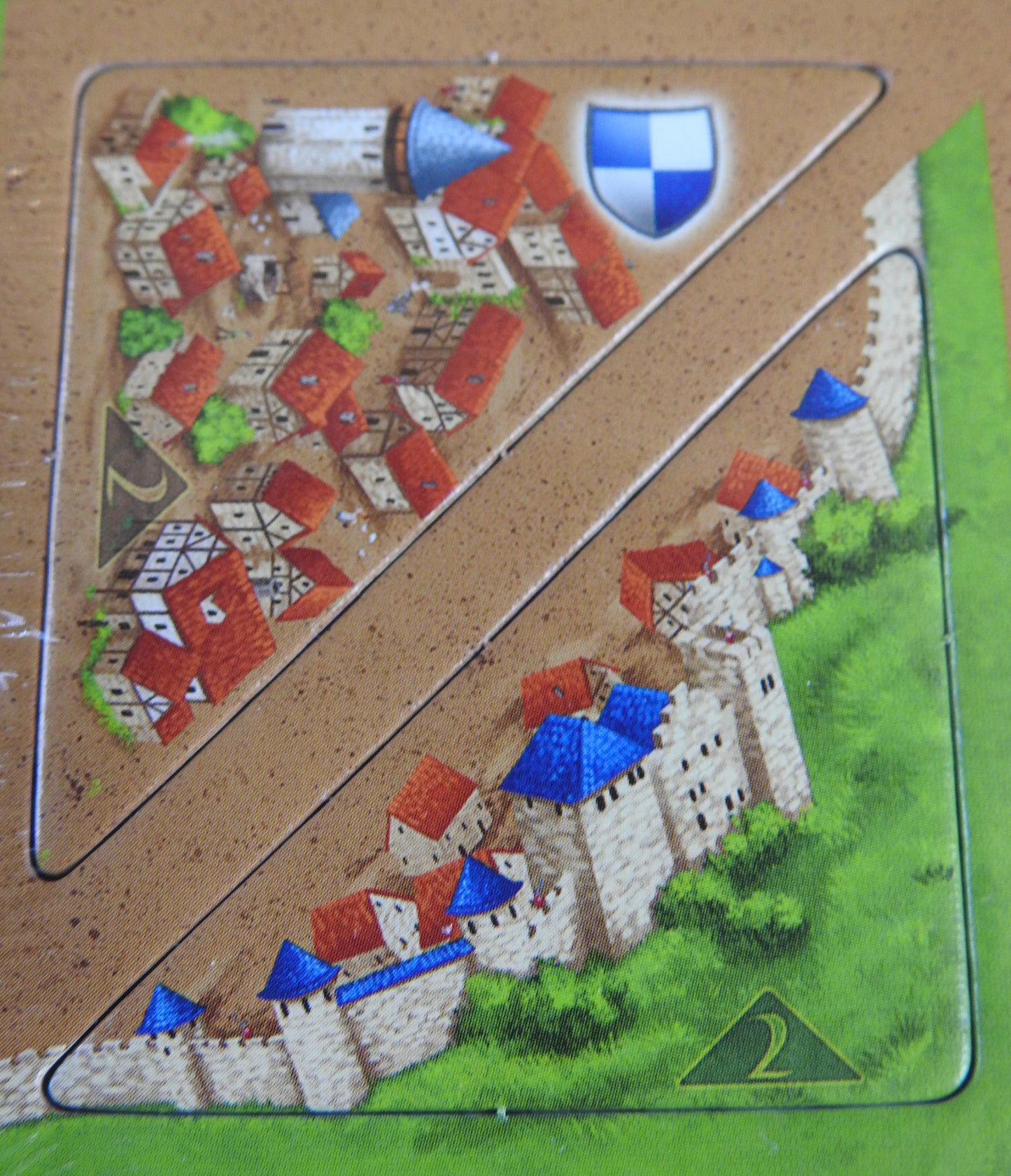 Close-up of two half tiles showing city walls.