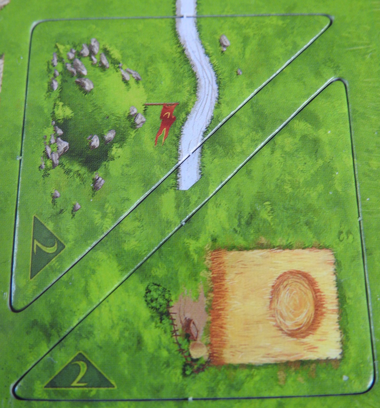 Close-up of 2 tiles showing a crop circle, road and hill.