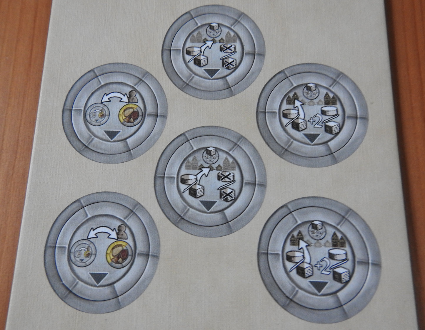 Close-up view of the front of the tokens, which come in 3 different types.