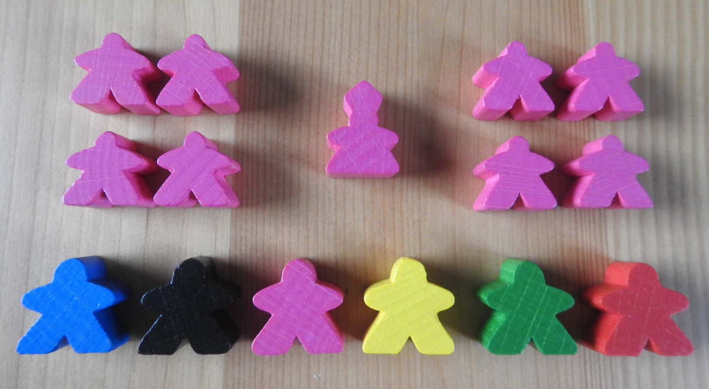 A view of just the meeples that come in a variety of colours with this Carcassonne Inns & Cathedrals expansion.