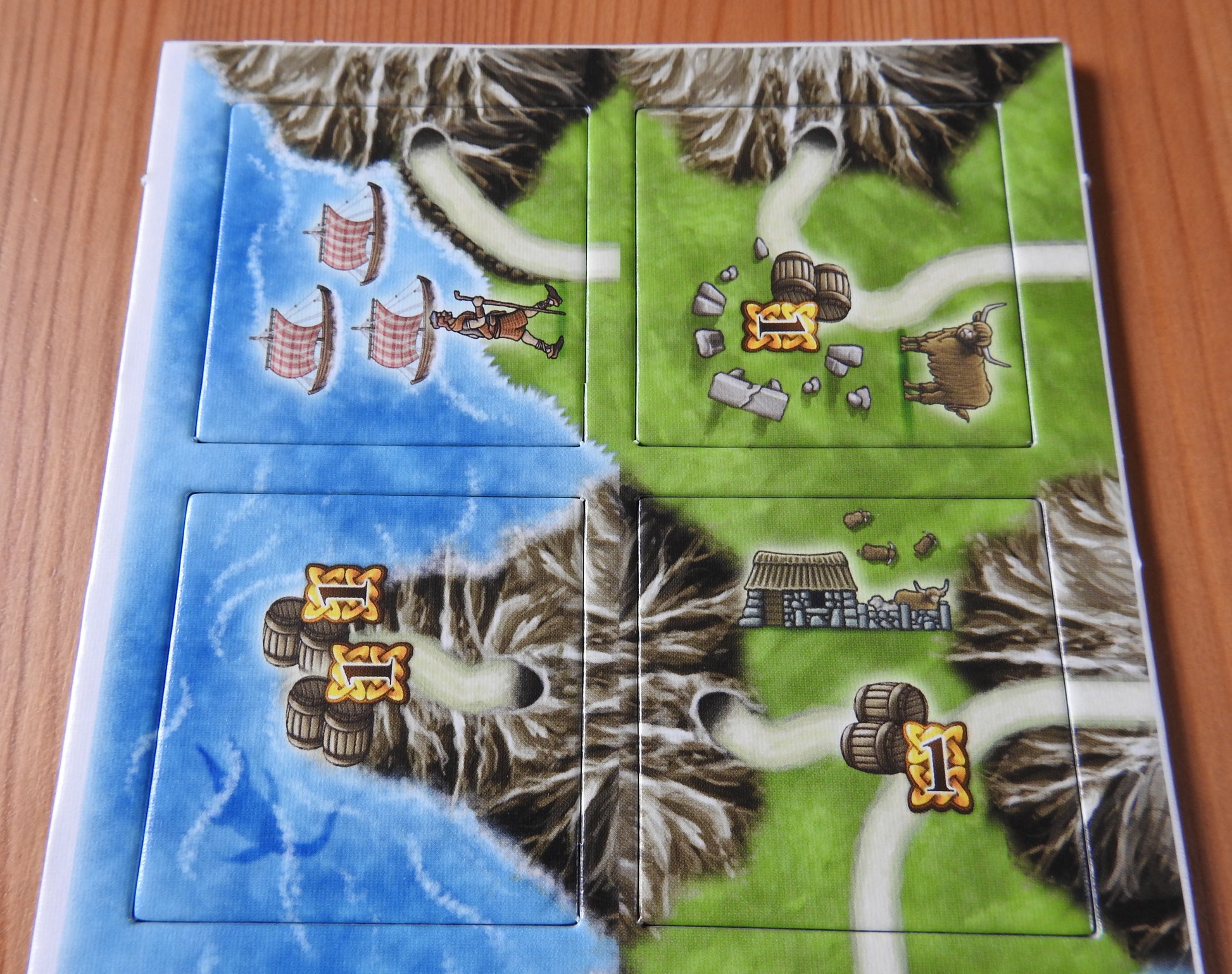 A closer look at some of the included tiles, featuring tunnels, boats and whisky barrels!