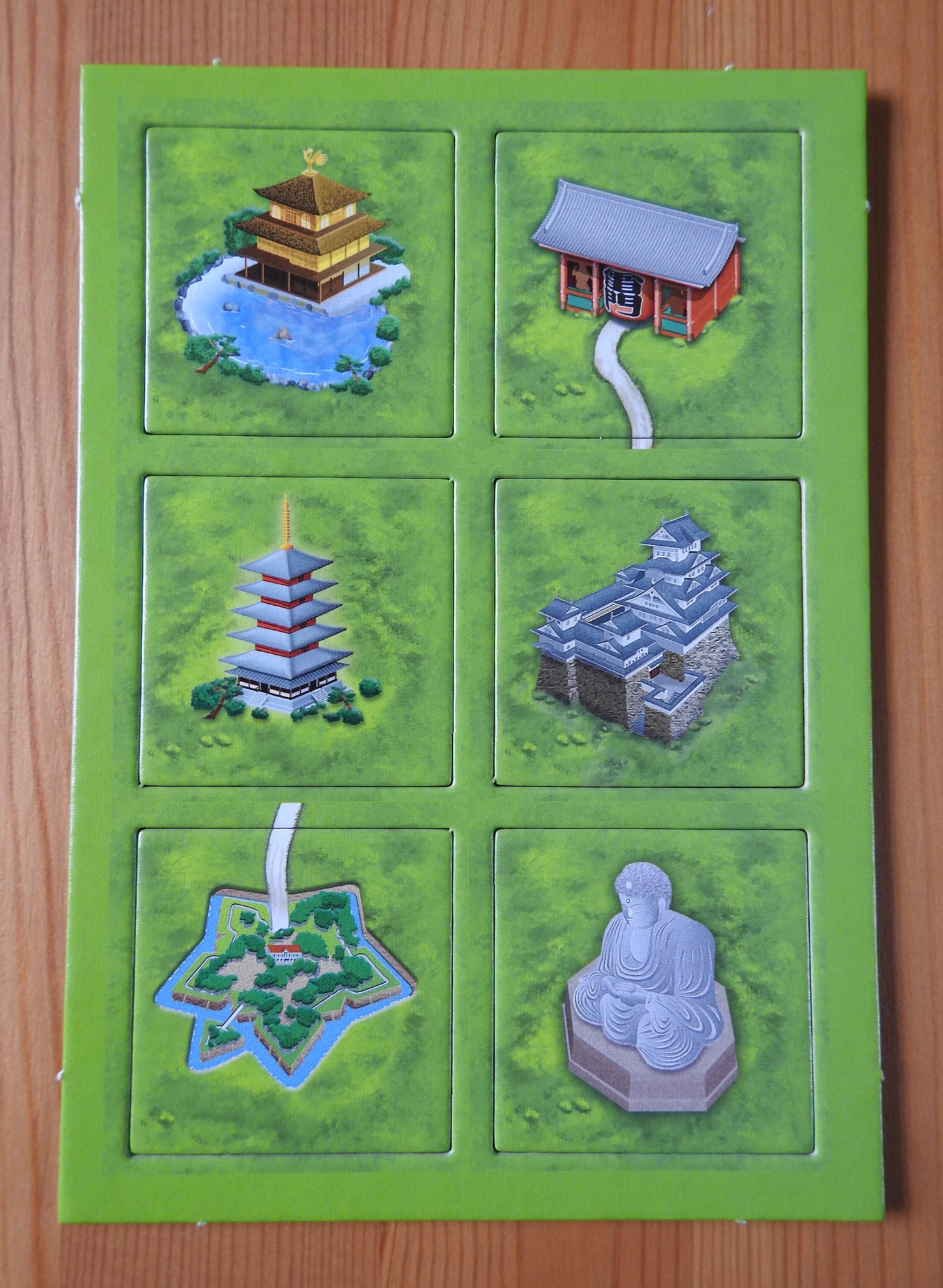 Front view of the 6 tiles featured in this Japanese Buildings mini expansion for the Carcassonne board game.