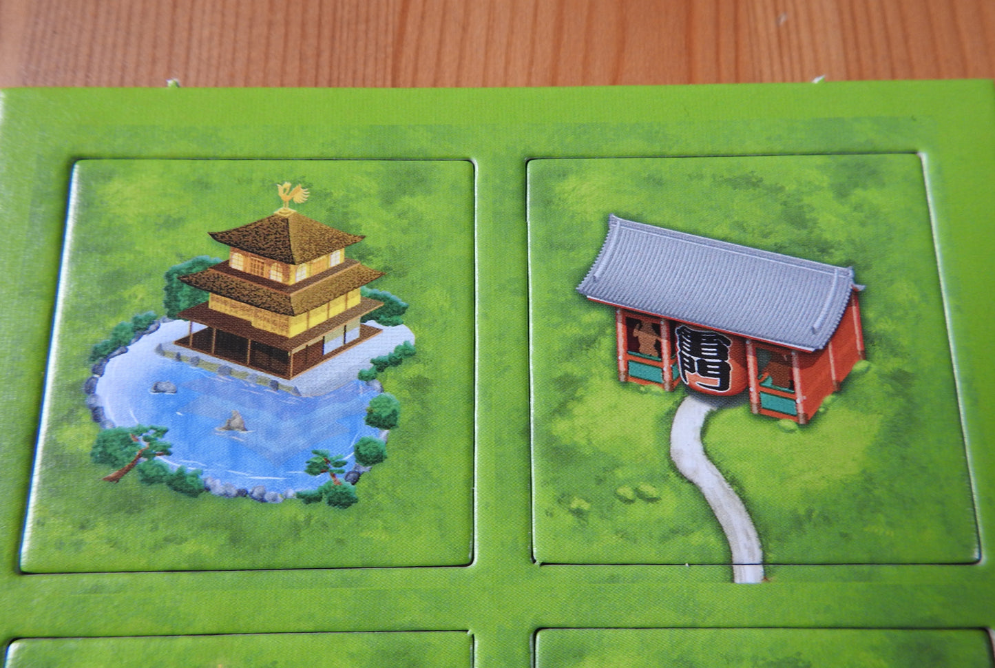 Closer view of some of the beautiful Japanese Buildings featured, including a golden temple and a shrine gate.