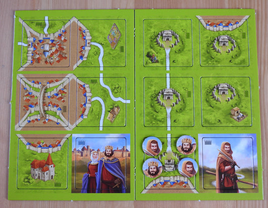 Top view of the 12 tiles and 4 tokens that come with this King, Robber & Cult Carcassonne Mini Expansion.