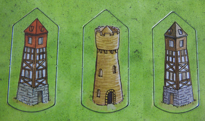 Close-up of 3 of the tower tokens.