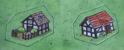 Close-up of 2 dwelling tokens.