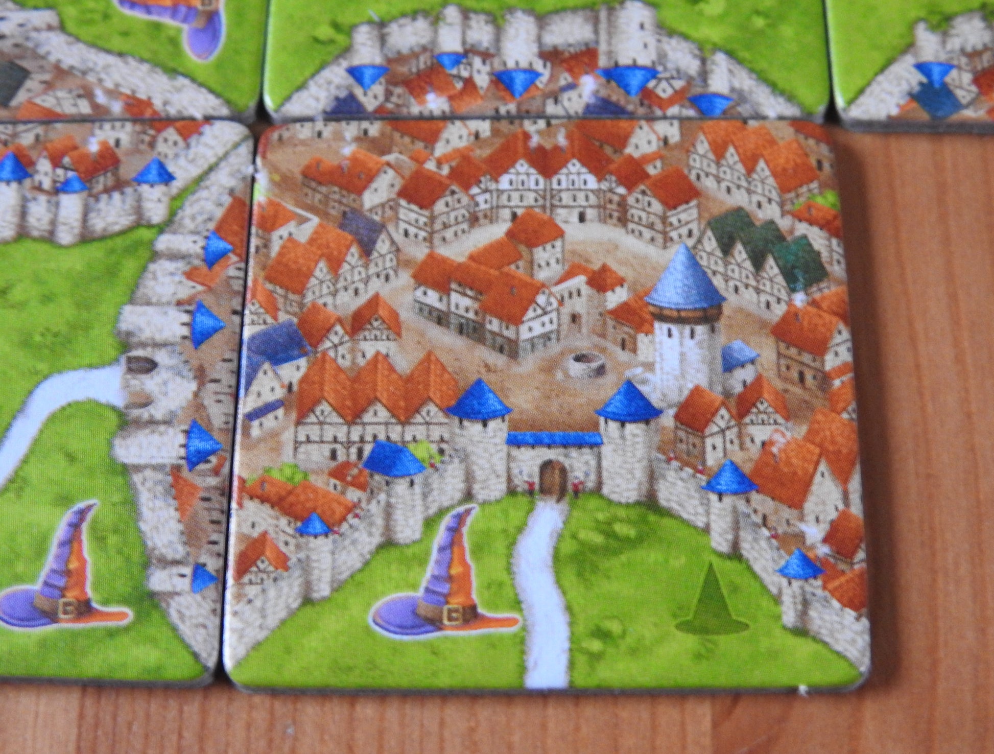 Close-up of one of the special landscape tiles showing a city in this Carcassonne Mage & Witch expansion.