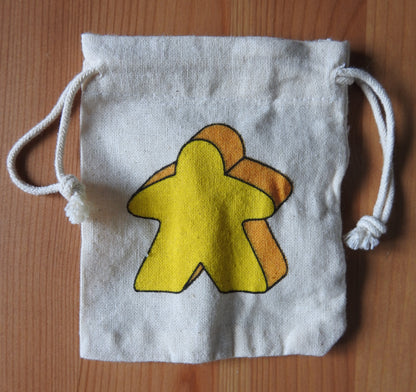 Close-up of the yellow meeple bag.