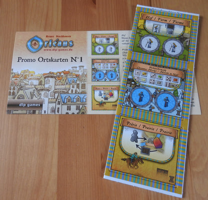 Top view of the 3 promo tiles and rules included with this Orleans - Promo Place Tiles No.1 mini expansion.