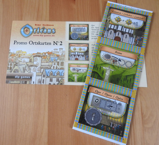 Top view of the 3 promo place tiles and rules included with this Orleans - Promo Place Tiles No.2 mini expansion.
